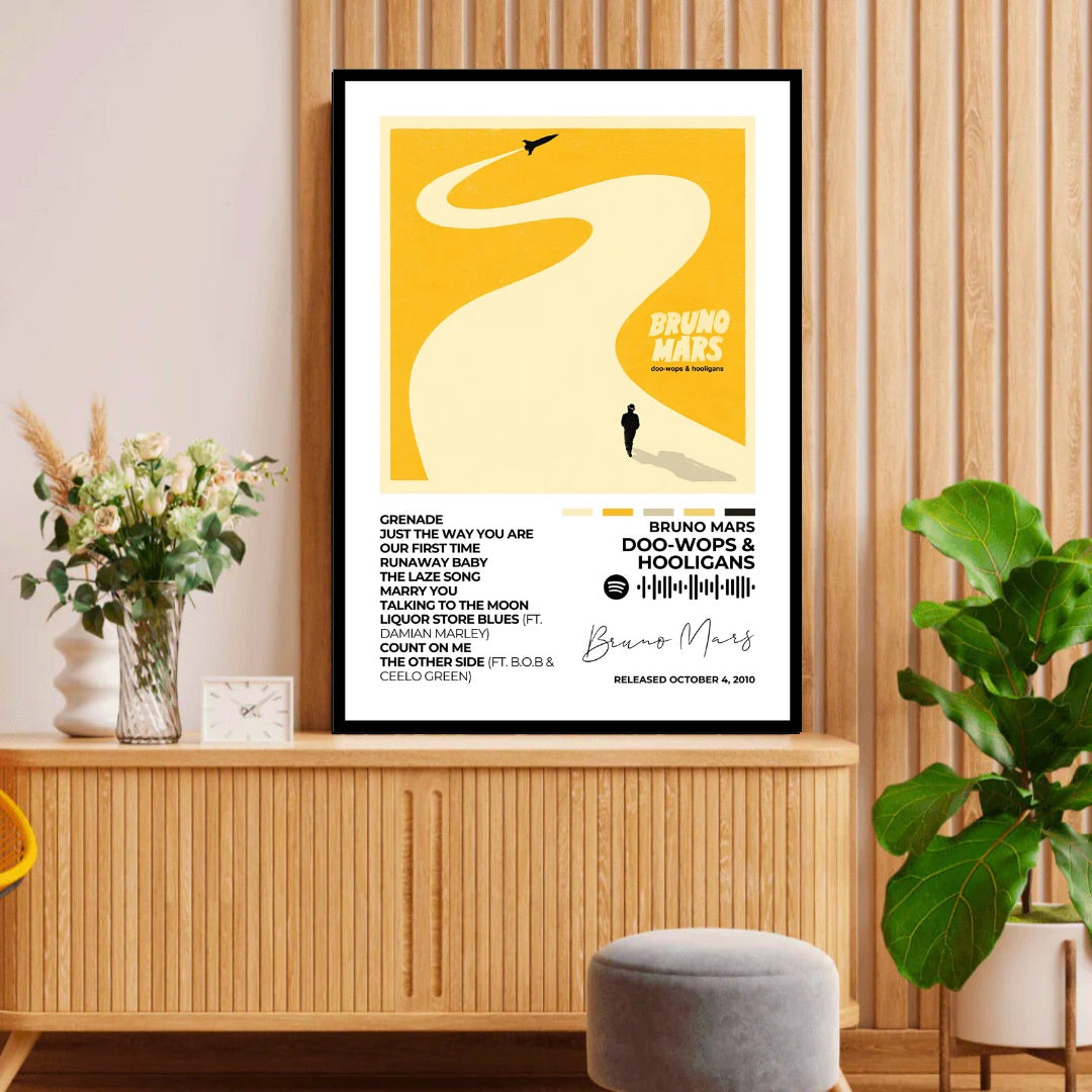 Bruno Mars – Doo-Wops &amp; Hooligans Feel the upbeat rhythms of Bruno Mars with this Doo-Wops &amp; Hooligans album cover poster. A vibrant addition that brings the album's infectious energy to your space.